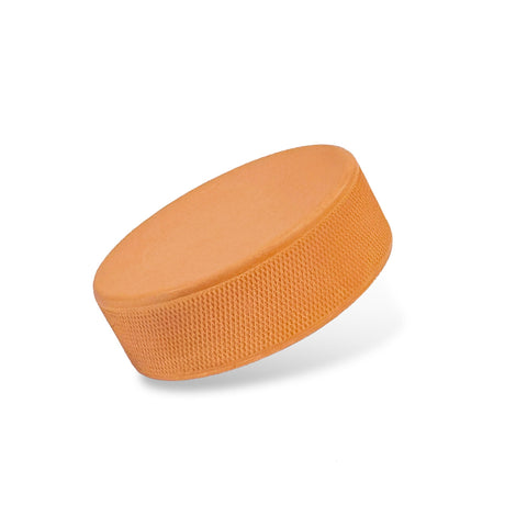 Orange heavy weight hockey puck for training, ideal for improving shot strength and technique, perfect for all players.